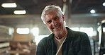 Carpentry, face and mature man in workshop with smile for manufacturing, production or confidence. Business, portrait and male supervisor for crafting, woodwork or furniture industry in warehouse