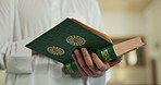 Person, hands or Quran for studying in Mosque for praying, gratitude or fasting to Allah in holy temple. Dua, Islamic or walking with Muslim book for reading or God on Ramadan Kareem in Saudi Arabia