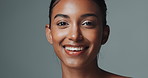 Face, skincare and beauty of happy Indian woman in studio isolated on gray background. Portrait, smile and young model in makeup for facial cosmetics, dermatology or healthy glow for aesthetic at spa