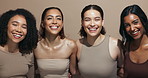 Face, laughing or hug for friends, skincare or wellness for diversity, inclusion or support in studio. Makeup, happy or confident women with facial glow, beauty results or smile on brown background