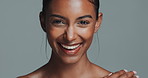 Woman, studio background and shirtless with smile for beauty or skincare, confidence or results. Female model, face or cosmetics on backdrop with happiness for dermatology, topless with makeup