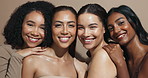 Face, happy or hug for friends, skincare or wellness for diversity, inclusion or cosmetics in studio. Makeup, support or confident women with facial glow, beauty results or smile on brown background