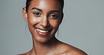 Portrait, skincare and beauty of happy Indian woman in studio isolated on gray background. Face, smile and young model in makeup for facial cosmetics, dermatology or healthy glow for aesthetic at spa