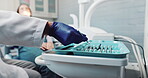 Dentist hand, tools and tray or closeup in clinic with choice for healthcare procedure or health consultation. Oral hygiene, dental person and working with mirror, excavator or orthodontic equipment