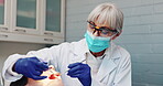 Woman, dentist and patient with teeth extraction at clinic for wellness, wellbeing and oral care. Female person, dental surgeon and doctor for canal procedure in healthcare with support and trust