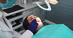 Oral care, woman and dentist with mirror for healthcare, consultation and cavity inspection in practice. Female patient, ppe and dental specialist with tools for examination, cleaning and filling