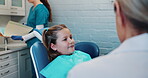 Dentist, girl and explain for dental care, trust and assistant for cavity or braces from professional person. Orthodontist, inspection and hands for toothache treatment, cleaning and equipment