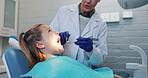 Mouth, oral care and dentist with child patient in office for appointment, checkup or examination. Healthcare, medical or teeth with orthodontist and girl client in chair for consultation or visit