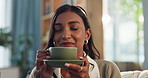 Happy woman, sofa and relax with coffee for aroma, warmth or soothing sensation at home. Calm female person or young indian with smile for warm beverage, caffeine or smell for morning drink at house