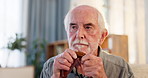Senior man, walking stick and thinking with retirement, stress and anxiety for alzheimer disease in home. Elderly person, mental health risk and worry for dementia with depressed, fear and disability