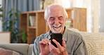 Home, smartphone and old man with typing, online reading and email notifications for good news. Senior person, apartment or pensioner with cellphone, social media or texting with funny video or humor