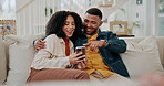 Black couple, laughing and phone for meme in home, talking and scroll on social media together on sofa. Happy people, embrace and reading funny ebook on weekend, texting and app for streaming online