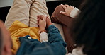 Couple, holding hands and relax with sofa above for love, care or bonding together at home. Top view of man or woman touching in relationship for leisure, free time or entertainment on couch at house