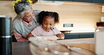 Child, grandmother and bake in kitchen in house, bonding and teaching culinary skills with family home. Happy, education and girl rolling dough on table, excited and development in apartment