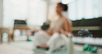 Woman, yoga and meditation with smoke for aromatherapy, zen or relaxation in spiritual wellness at home. Female person in blur or lotus pose with burning essence or incense for inner peace at house