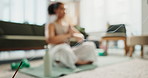 Woman, yoga and namaste on floor in home with incense, peace and meditation for wellness in living room. Person, zen and mindfulness with smoke, fragrance and relax  in lounge on mat in New Zealand