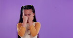 Playful, kid and face with fist in studio for funny boxing, comedy and power of silly child. Adorable, little girl and laugh with gesture of fight for courage, challenge or humor on purple background