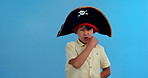 Pirate, costume and face of child with Halloween in studio for character, cosplay and game in hat. Kid or boy with expression, voice and announcement of fantasy or dress up on green screen background