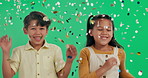 Happy children, jumping and celebration with confetti on green screen, studio or background. Portrait of excited little boy and girl with smile in glitter or sparkles for festive, party or new year