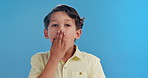 Wow, surprise and face of child on blue background for news, announcement and information. Youth, childhood and portrait of young boy with facial expression, emoji reaction and shock in studio