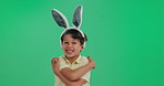 Bunny ears, portrait and child in studio with hug, smile or identity development for happy kid. Care, self love and boy with positive attitude, rabbit costume or confident mindset on green background