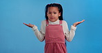 Little girl, question and unsure with hands out for choice, decision or option in studio on a yellow studio background. Portrait of female person, child or clueless kid in wonder, curious or confused