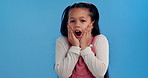 Shock, wow and face of child on blue background for news, announcement and information. Youth, childhood and portrait of young girl with facial expression, emoji reaction and surprise in studio