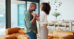 Couple, dancing and hug in lounge, happy and excited for new home, love and saving for dream house. Living room, man and woman in commitment of marriage, mortgage and embrace for celebration and loan