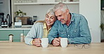 Love, coffee and mature couple in kitchen in conversation on weekend morning for bonding together. Happy, hug and senior man and woman talking and laughing for comedy and drinking cappuccino at home.