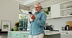 Phone, coffee and senior man in home with notification for networking online with email. Happy, cellphone and mature person drink cappuccino with communication for internet connectivity in kitchen.