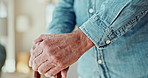 Walking stick, hands and senior man in home for recovery, balance or mobility aid for steps. Retirement, wood cane and closeup of elderly male person with a disability in rehabilitation for healing.