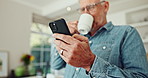 Phone, coffee and mature man in kitchen with pride for stock investment profit with online bank app. Happy, cellphone and senior male person drink cappuccino and reading news blog on internet at home