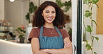 Arms crossed, happy and laughing with coffee shop waitress in doorway for hospitality or welcome. Cafe, funny and smile with portrait of barista woman in restaurant for small business or startup