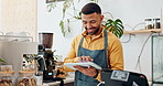 Man, cafe and tablet for online shopping, order or review as employee in small business. Male person, barista and tech for communication, community management or stock control with happiness or smile