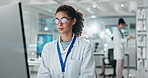 Woman, scientist and typing on computer in lab for medical research, assessment report and results information. Smile, doctor and pc for test analysis, feedback news and pharmaceutical innovation
