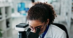 Woman, microscope and examine research in laboratory, analysis and virus or vaccine sample for healthcare study. Cure development, scientist and record data results, investigation and innovation