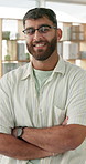 Smile, crossed arms and face of man in office with confidence for growth in programming career. Happy, pride and portrait of professional male software developer at startup it company in France.