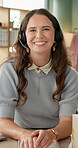 Portrait, happy woman and headphones in call center for communication and consulting. Employee, telemarketing and customer service in office or workplace with smile or pride for advisory or services