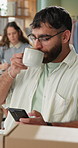 Man, coffee and drinking with phone in logistics for supply chain, distribution or morning at warehouse. Young male person or employee with beverage on mobile smartphone for online order or inventory