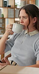 Woman, cellphone and coffee in workplace for relax, rest and break from working at desk. Technology, cappuccino or tea and web designer thinking or idea in creative agency for digital or mobile app