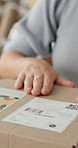 Business woman, hands and box with label for logistics, shipping or delivery at warehouse. Closeup of female person with sticker on cargo, parcel or package for distribution, ecommerce or order