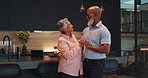 Dancing, love and mature couple in kitchen with romance to music, radio or song at home. Care, connection and senior man and woman embracing for groove and cooking dinner meal at apartment together.