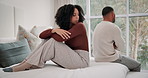 Frustrated, couple and angry with fighting on bed for toxic marriage conflict, divorce and problem at home. Unhappy, people and stress with anxiety for miscommunication, argument and silent treatment