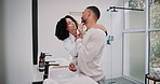 Bathroom, couple and love with support in home, wellness and care with hug in marriage with embrace. Happy people, woman and man for morning routine, grooming and bonding together in modern house