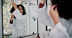 Brushing hair, mirror and smile with woman in bathroom of home for daily or morning routine. Beauty, face and reflection with happy person getting ready in apartment for grooming or haircare