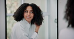 Beauty, brushing hair and mirror with woman in bathroom of home for daily or morning routine. Comb, hairbrush and reflection with smile of happy person in apartment for grooming or haircare treatment