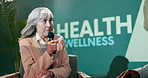 Conference, woman and speaker at stage for speech, talk or question with host at workshop. Panel, mic and mature person at seminar event for presentation on health, wellness or advice at auditorium