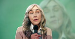 Senior woman, mic and speaker at convention for speech, discussion and networking opportunity in industry. Presenter,   talking and public speaking for conference, audience and international guests