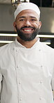 Portrait, chef and happy man at restaurant in kitchen for career, job or catering. Face, smile or cooking professional in small business with culinary expert, worker or employee in Brazil for service