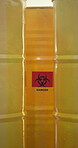 Science, bin and container in laboratory with danger sign for contaminated or chemical waste, toxic material and biohazard. Warning symbol, dangerous goods and barrel for environmental safety